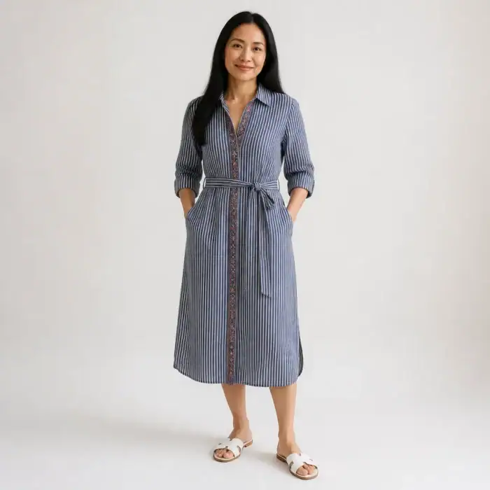 Woman in a striped linen shirt dress with a block-printed placket