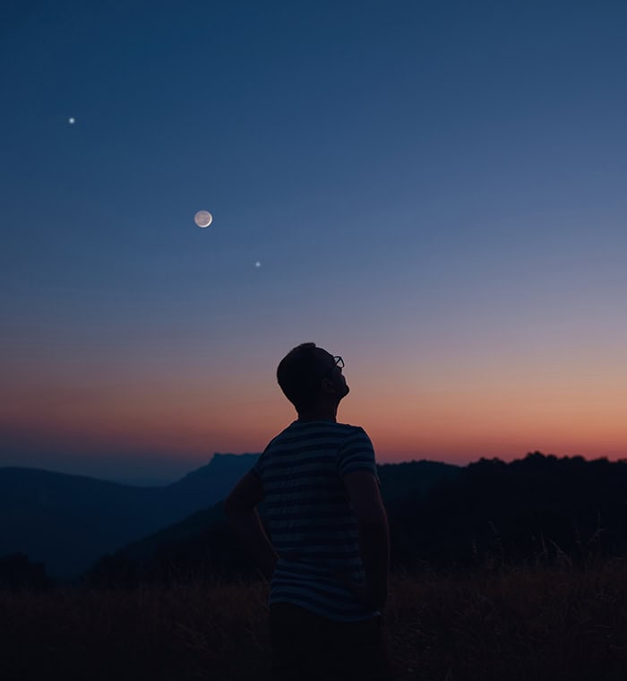 Man Looking up into the night sky - Do you ever wonder if God watching you?