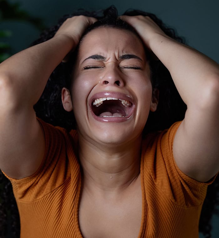 Woman crying out in grief. "God Please Help me!"
