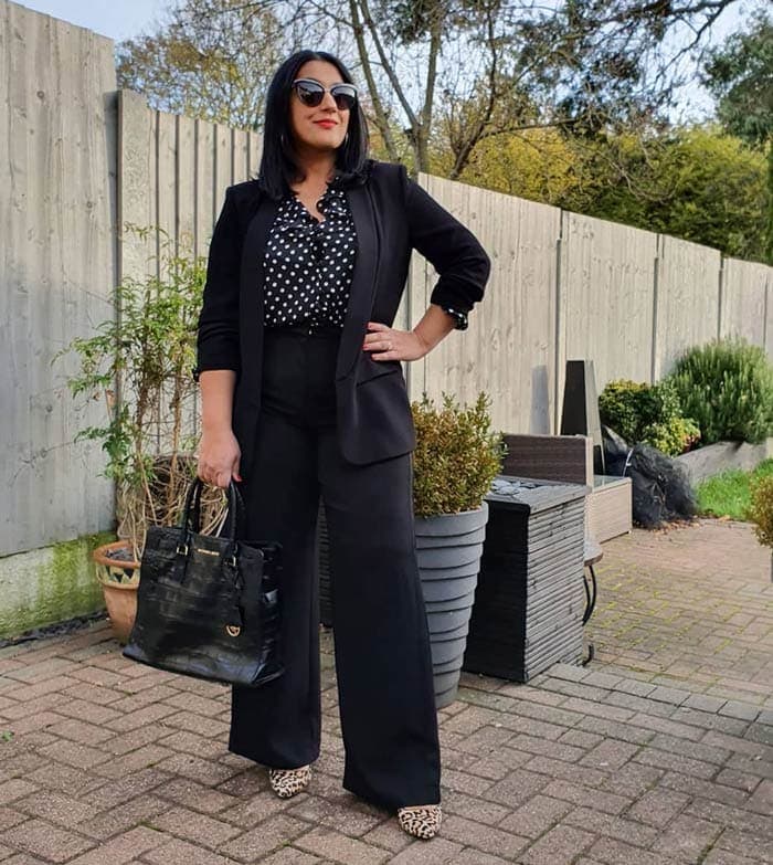 What to wear to a conference: Jas wears a black pant suit | 40plusstyle.com