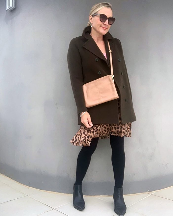 Melinda wears opaque tights with her leopard print skirt | 40plusstyle.com