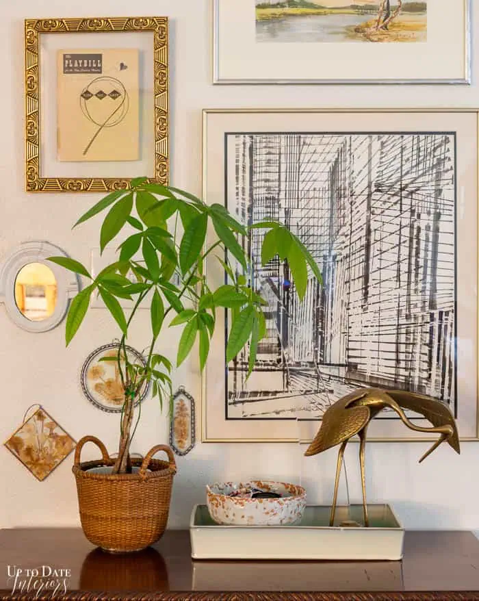 Brass crane and money plant with art