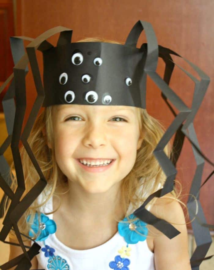 girl wearing a spider headband