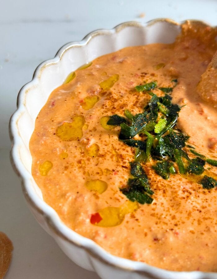 Feta Paprika Dip - Easy & Quick Dip Recipe 3 close up of paprika dip in a bowl with parsley on top and olive oil