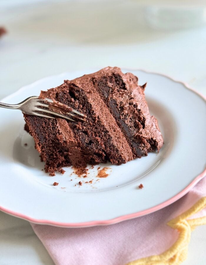 Delicious Matilda's Cake - Fudgy & Moist Chocolate Cake 6 close up of a slice of matildas cake with a fork on top, towel under