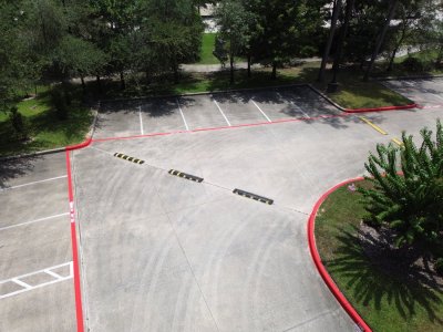 Blue ADA handicap parking stall with white accessibility symbol