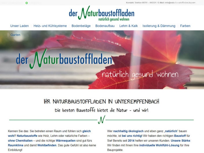Screenshot der Startseite des Naturbaustoffladens mit einem roten Blatt im Hintergrund, dem Schriftzug „der Naturbaustoffladen – natürlich gesund wohnen“ und Informationen über ökologische Baustoffe