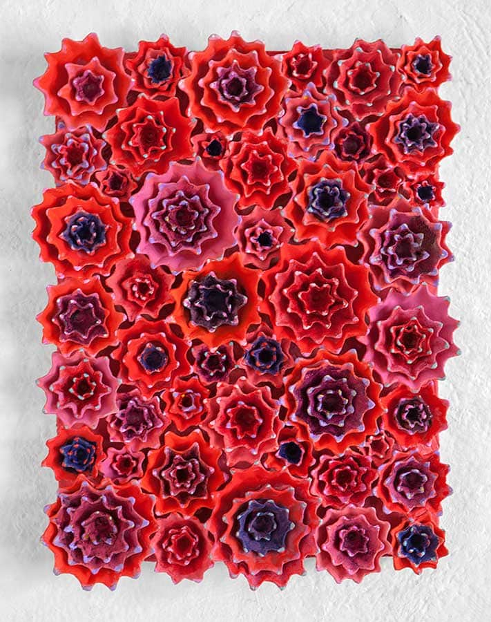 The first day sky 2012, Sculpture by Kazumasa Mizokami, similar to the previous work, but in different colours mostly in red. pointy parts of flower petals coloured in blue.