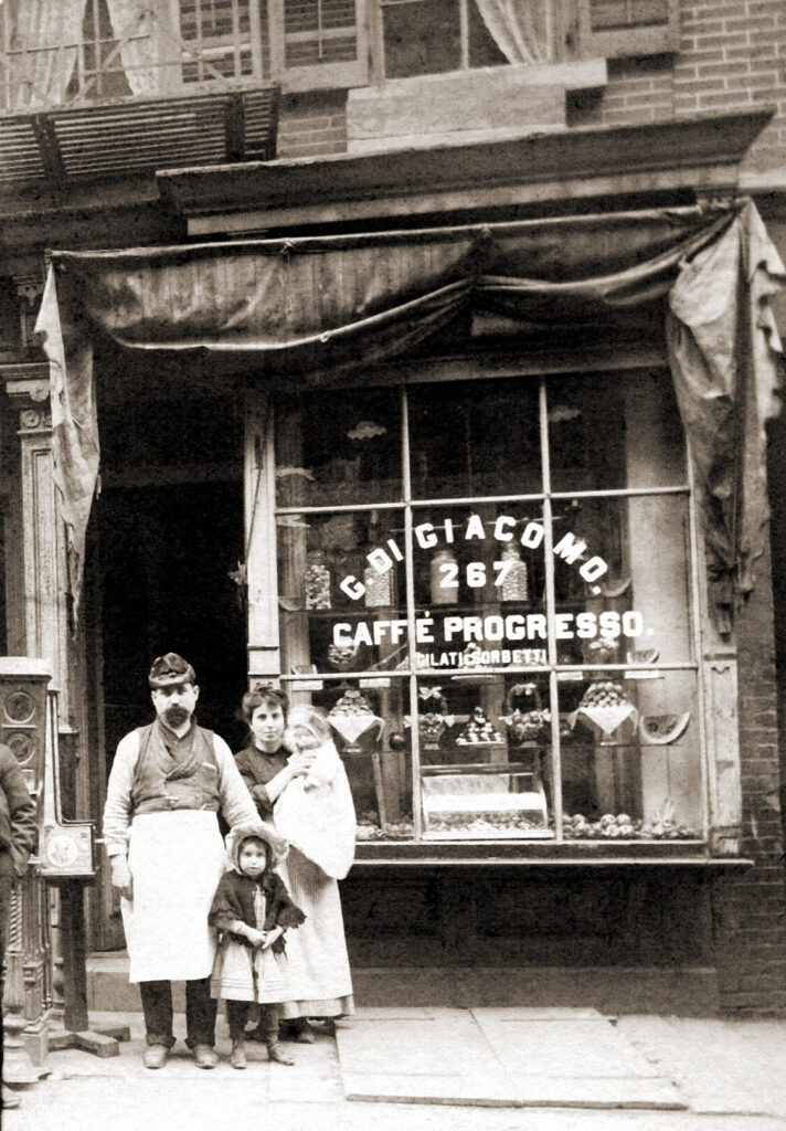 A black and white photo of Italian eatery owner Michael Bongiorno's family in front of their patisserie shop in Little Italy