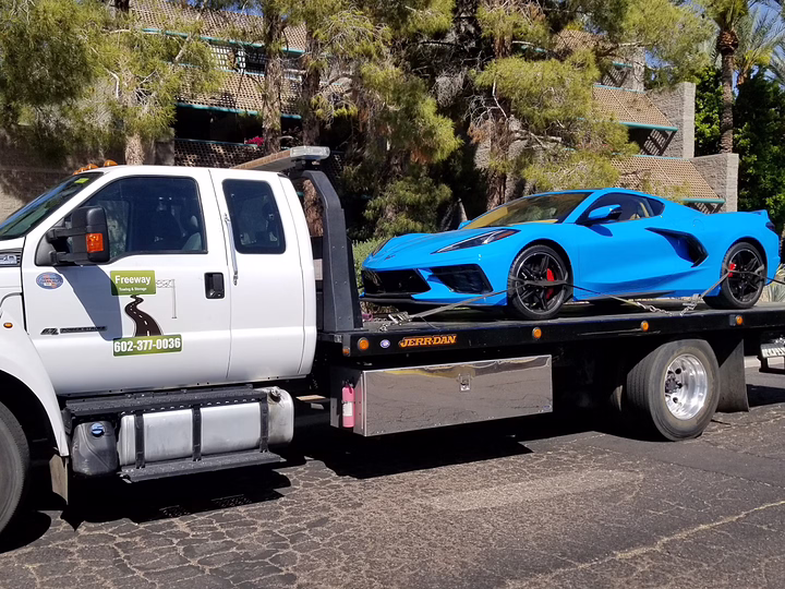 Chevrolet C8 Corvette Stingray being towed on a flatbed