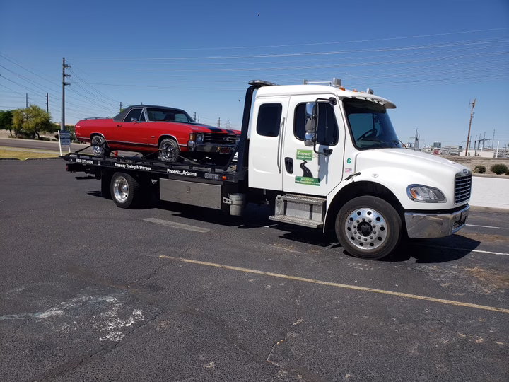 1971 Chevrolet Monte Carlo being towed on a flatbed in Scottsdale, AZ