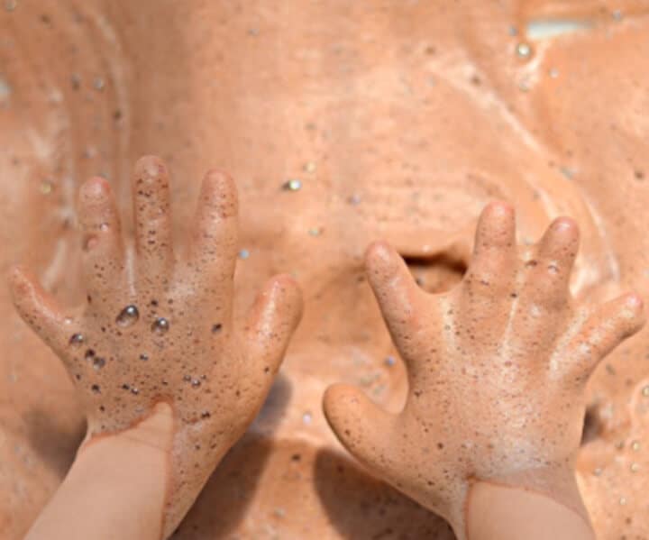 sensory bin for indoor play featuring chocolate soap foam