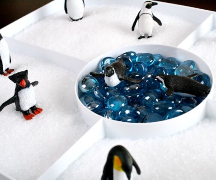 fun winter activity for kids featuring penguin sensory play