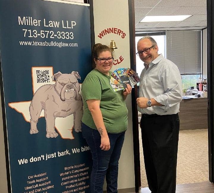 Contest winner smiling with Texas Bulldog Law branding