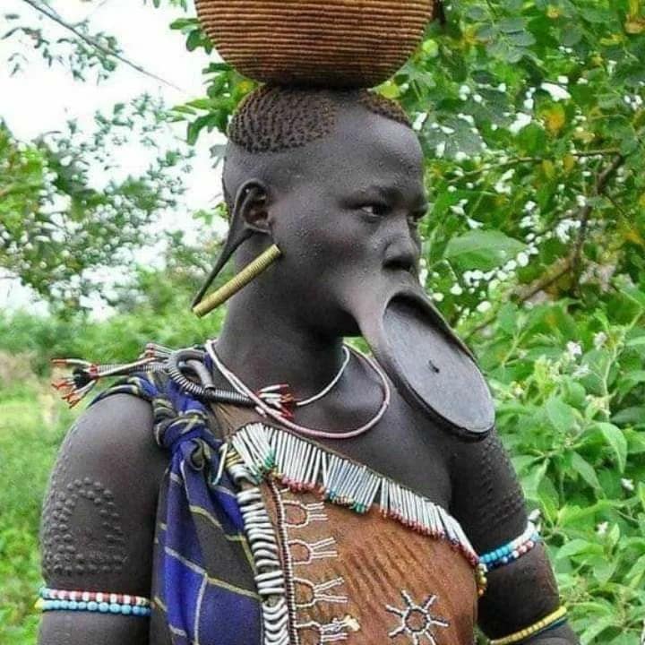 Mursi woman in Omo Valley wearing traditional lip plate – symbol of identity and beauty