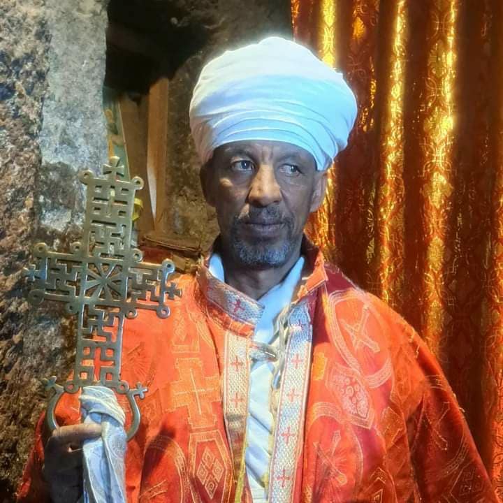 Ethiopian Orthodox priest holding a cross – symbol of faith and tradition