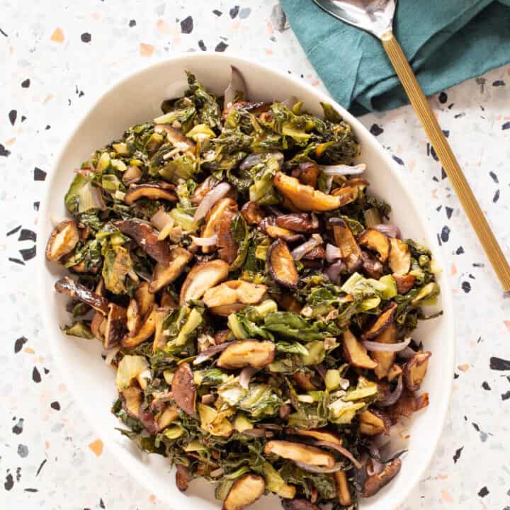 roasted mushrooms and greens on a platter