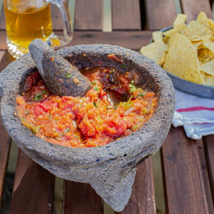 salsa in a molcajete with chips