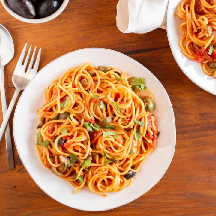 plates of puttanesca pasta