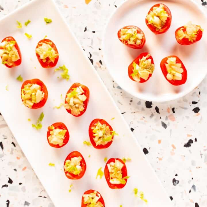 appetizer plates of Bloody Mary tomatoes stuffed with celery
