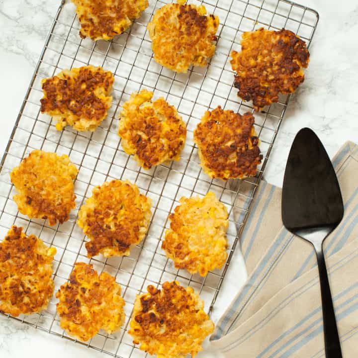 Corn fritters with sneaky cauliflower rice make a substantial vegetarian meal. Serve with your favorite dipping sauce! #cornfritters #vegetablefritters #vegetarian