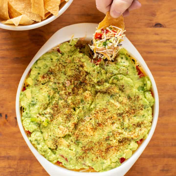 Seven layer dip is a favorite game day and party appetizer - assemble it this way for easier dipping!
