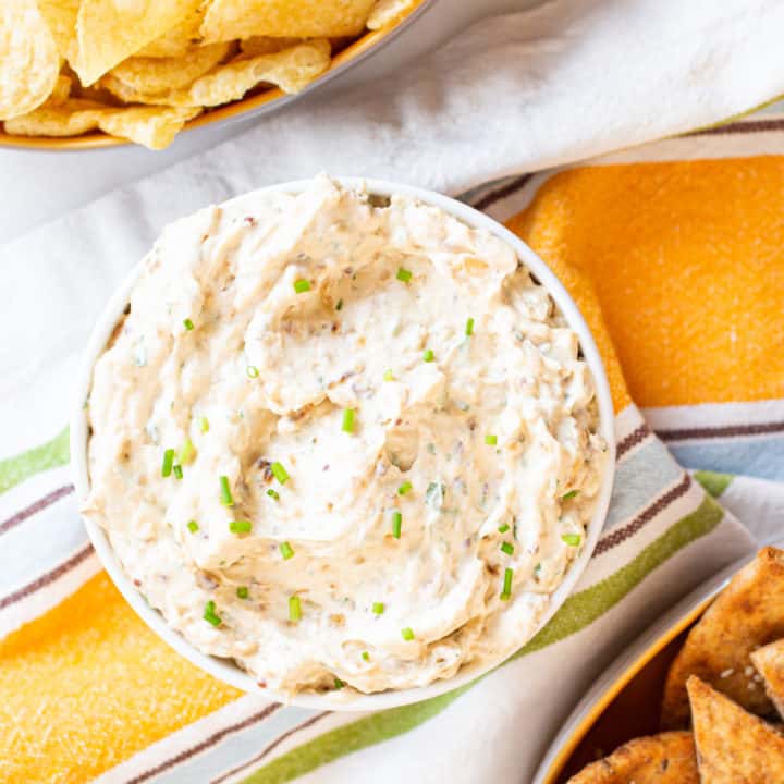 french onion dip with potato chips and pita chips