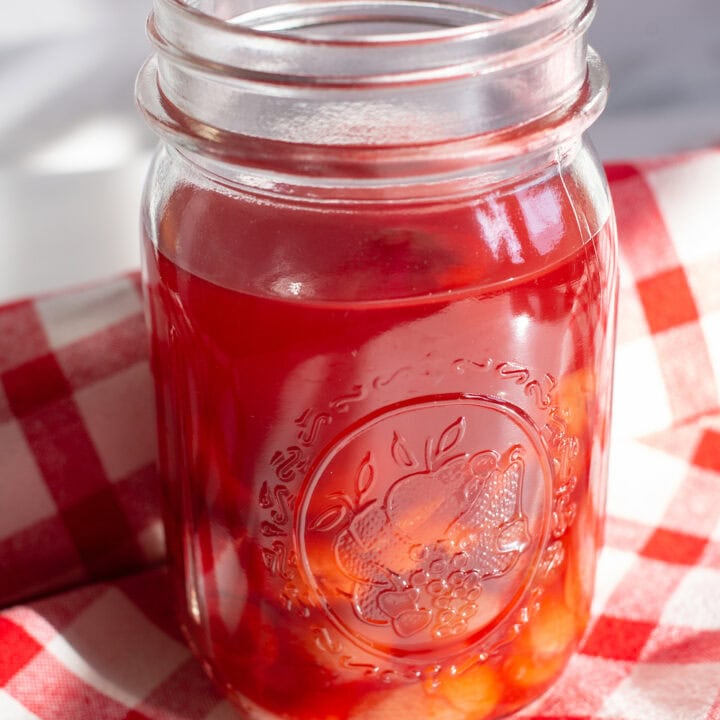 mason jar filled with sour cherry shrub