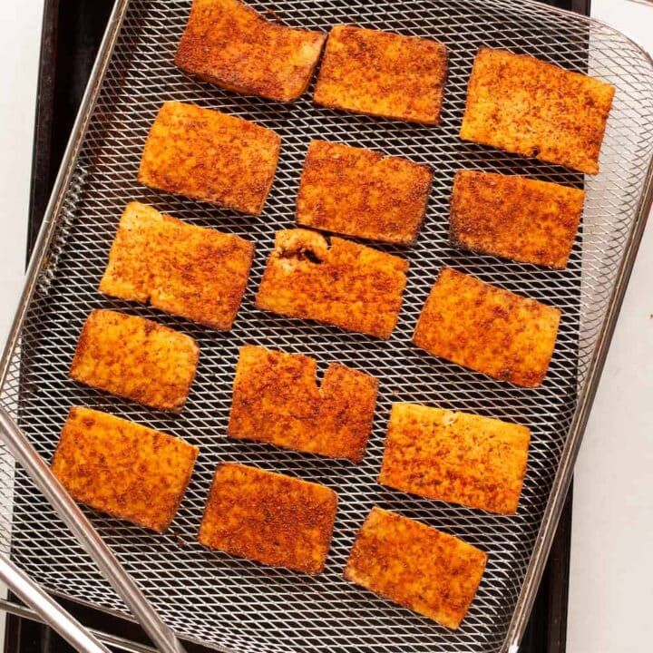 air fryer rack of cooked vegan tofu pastrami