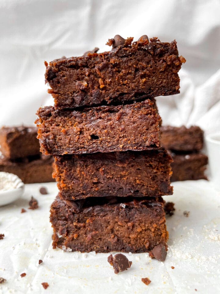 close up of four brownies stacked on top of each other