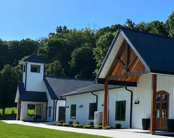 Exterior of the Romaine Valley wedding chapel and event building with landscaped lawn
