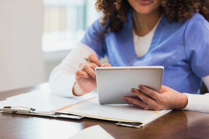 Woman filling out patient forms
