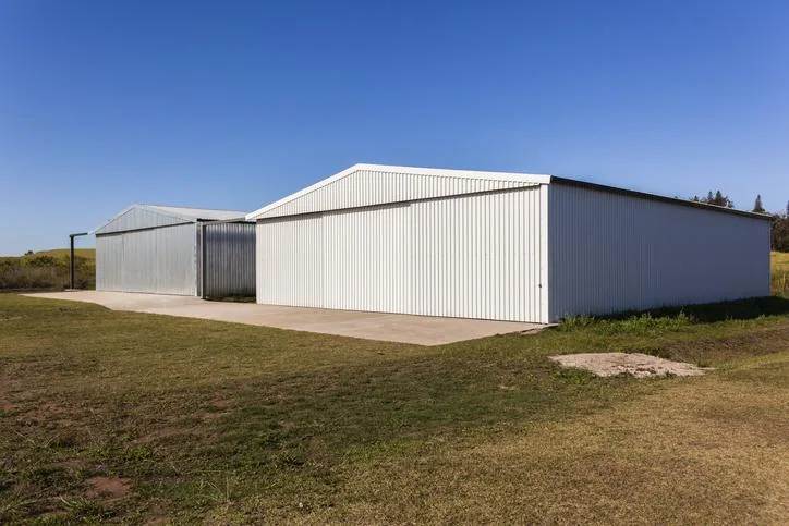Steel equipment and hay storage building on a farm