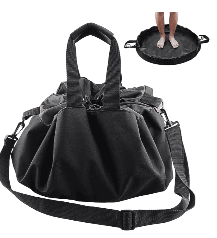a changing matt that goes into a drawstring bag black