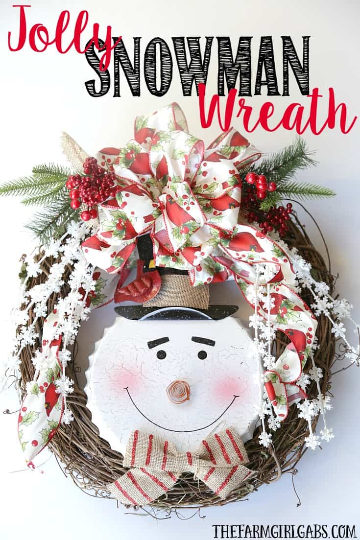 Brighten your Christmas decor with this simple DIY Jolly Snowman Christmas Wreath. This holiday craft idea is perfect hanging on a door at home.