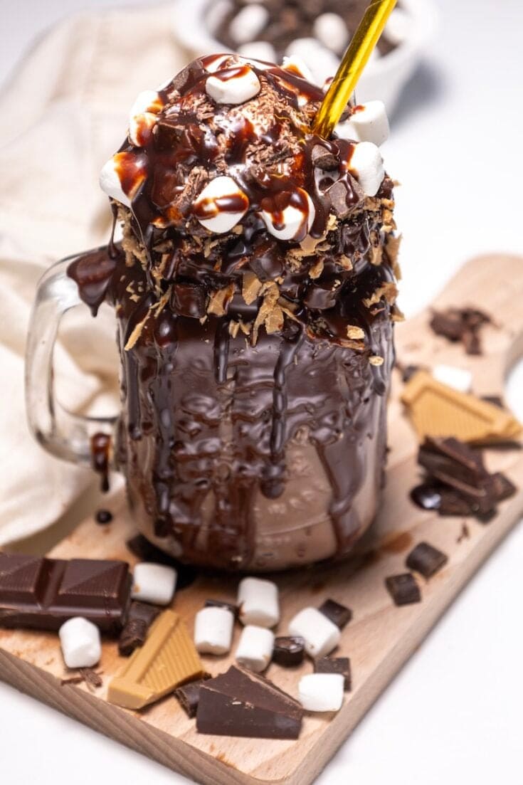 Craving something sweet and over the top? This Extreme Chocolate Freakshake recipe is loaded with chocolate milk, ice cream, marshmallows, and all your favorite candy toppings. Ready in just 20 minutes, it's the ultimate dessert for chocolate lovers and freakshake fans.