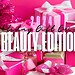 Festive pink-themed holiday scene with wrapped gift boxes, sparkly decorations, and the text "2024 Holiday Gift Guide: Beauty Edition.