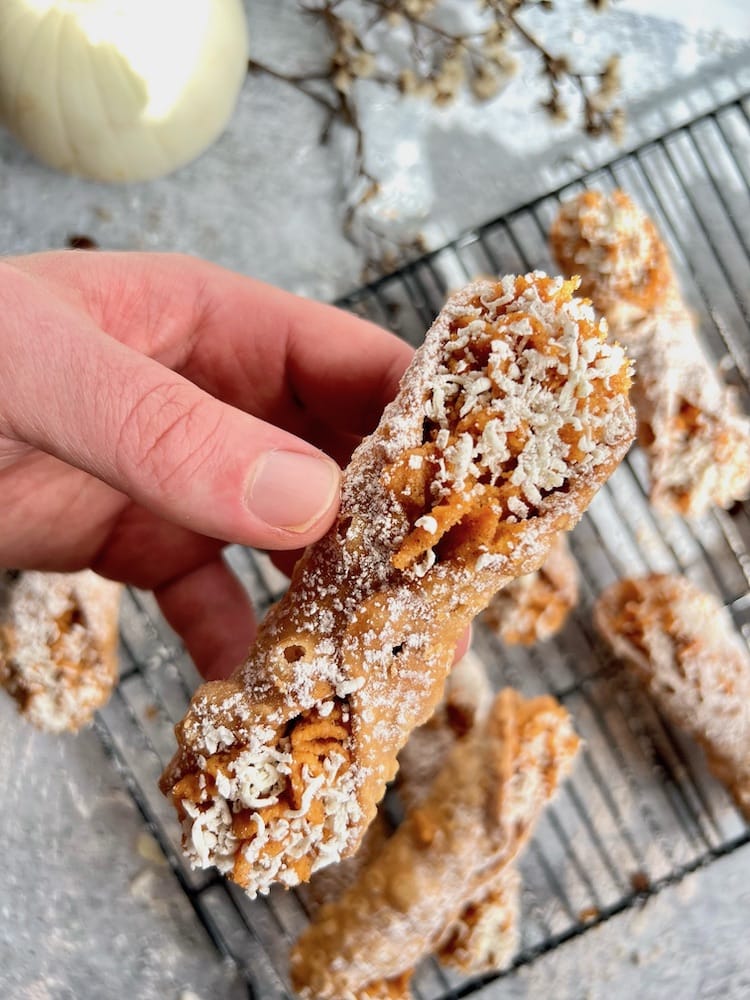 Pumpkin Cannoli in hand Pumpkin Cannoli held in hand