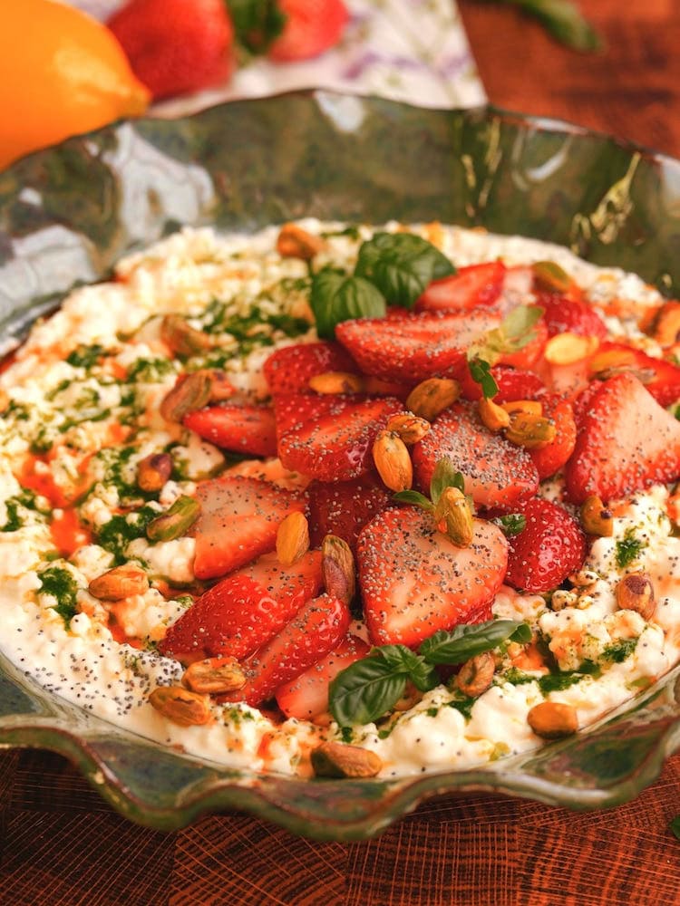 Strawberry Basil Cottage Cheese Bowl 1 WEB A Strawberry Basil Cottage Cheese Bowl surrounded by fresh strawberries and a lemon