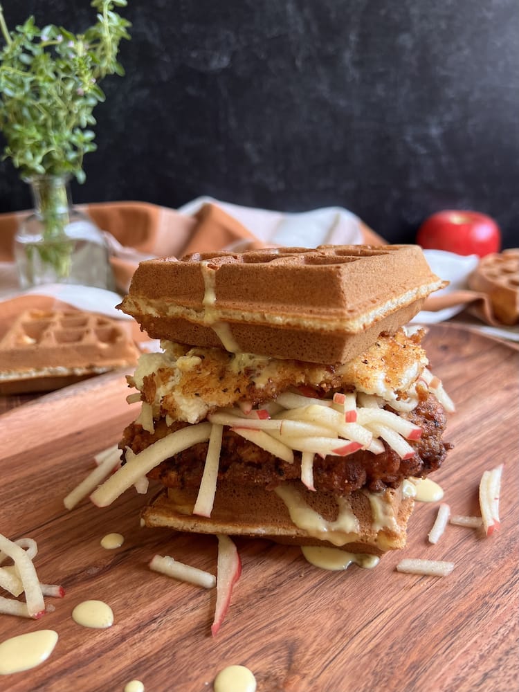 Barn & Orchard Waffle Sandwich 1 A Barn and Orchard Waffle Sandwich on a wooden cutting board