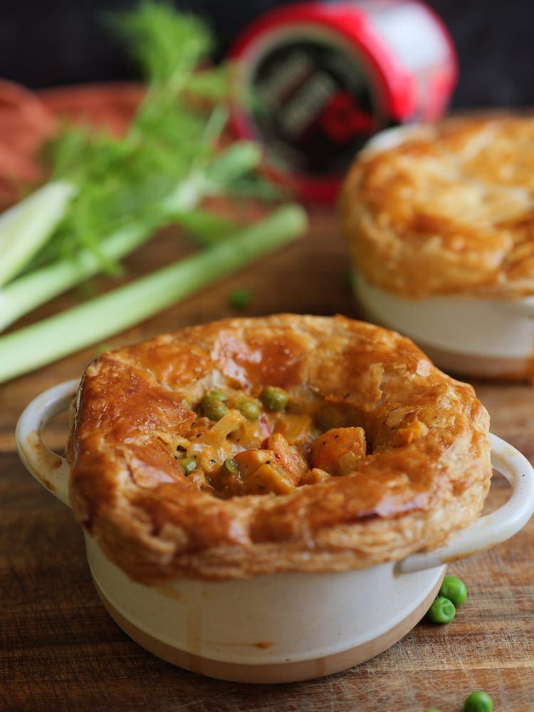 Lobster Pot Pies - 4 WEB Two Lobster Pot Pies on a wooden cutting board with fresh fennel in the background