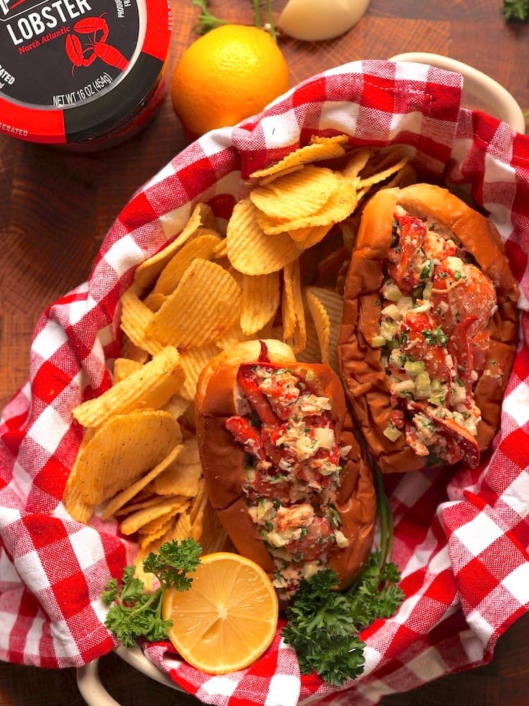 Maine Style Lobster Roll - Vertical 1 WEB Maine Lobster Roll in a red and white checkered cloth basket