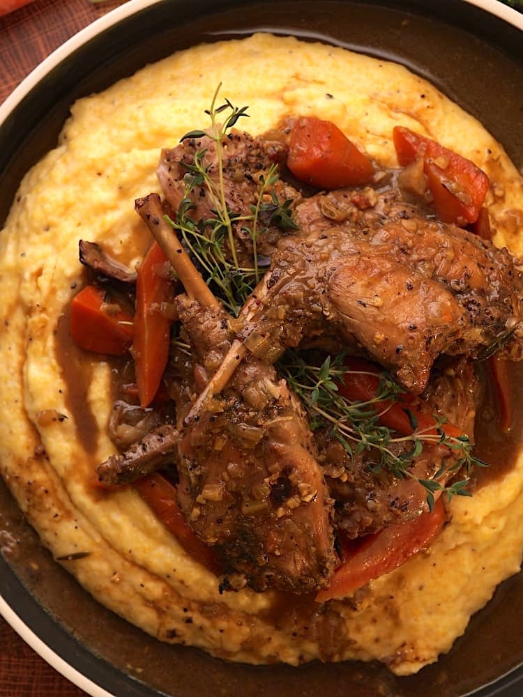 Braised Rabbit with Creamy Polenta Braised Rabbit with Creamy Polenta in a large dish served family style