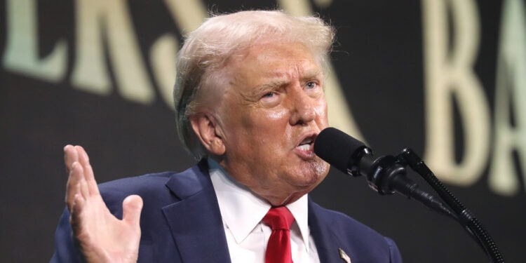 Donald Trump speaking with attendees at The Believers Summit. [Gage Skidmore]