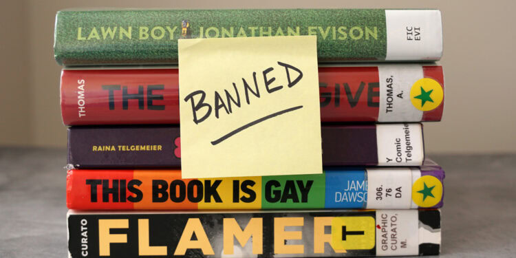 Books with sticky note labeled "BANNED" placed over titles, highlighting censorship of literary works in the context of psychological and societal impacts.