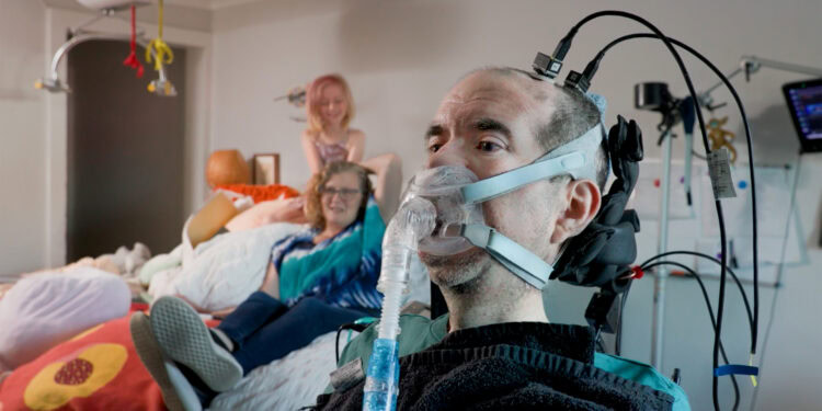 Trial participant Casey Harrell, pictured here in May 2026 with his family, has used the brain-computer interface at his home for two years. [Regents of the University of California, Davis]
