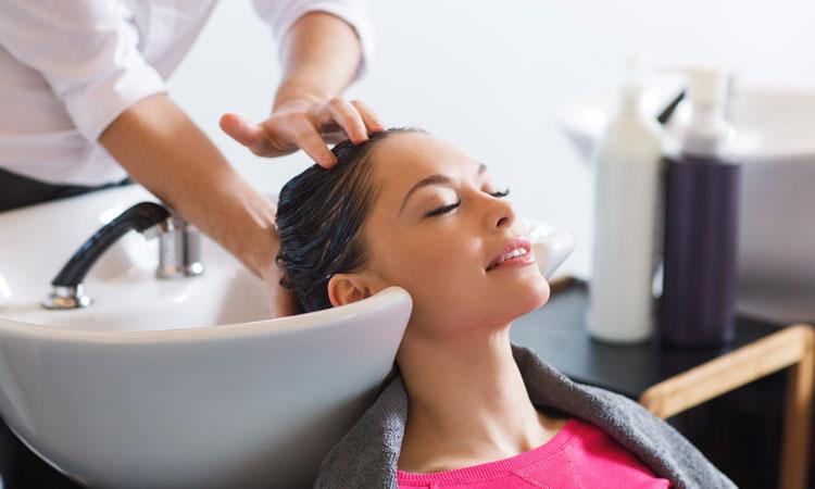 woman at hair salon getting hair washed