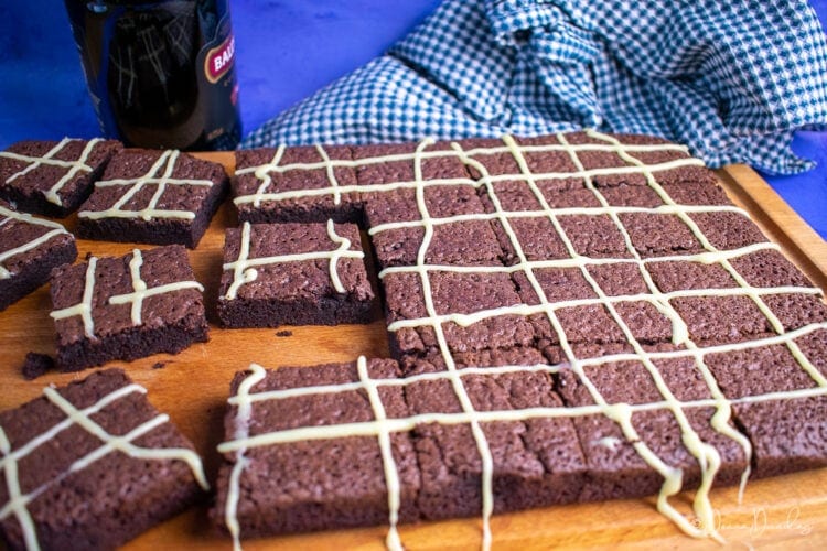 Sliced Bailey's brownies on chopping board