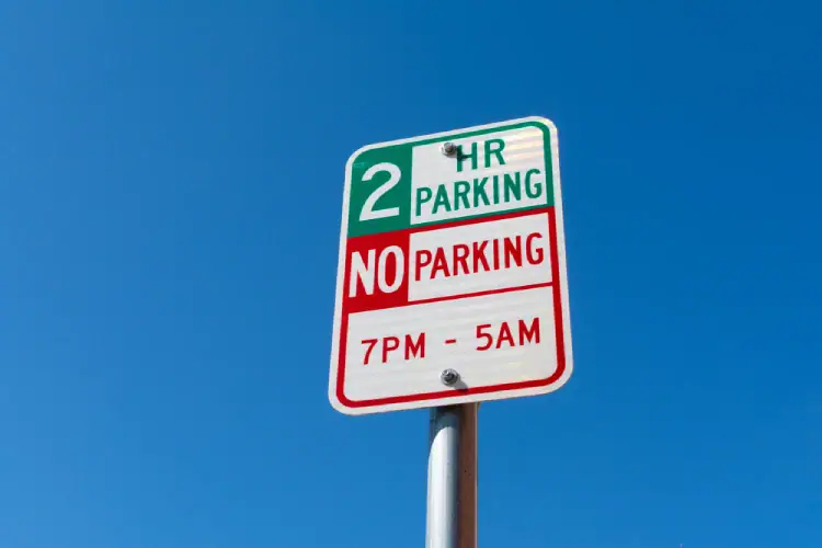 Denver-street-sign-showing-two-hour-parking-and-no-parking-restrictions-for-moving-trucks.