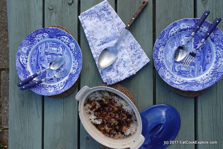 Quick Chicken Biryani cooked in a blue cast iron pot, for a weeknight supper, served with a blue willow design, blue and white plates.  